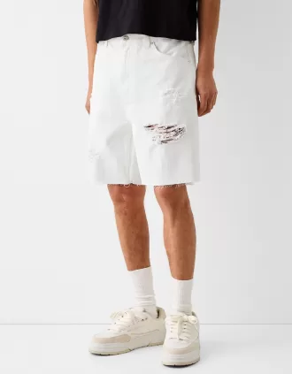 Bermuda in denim strappato