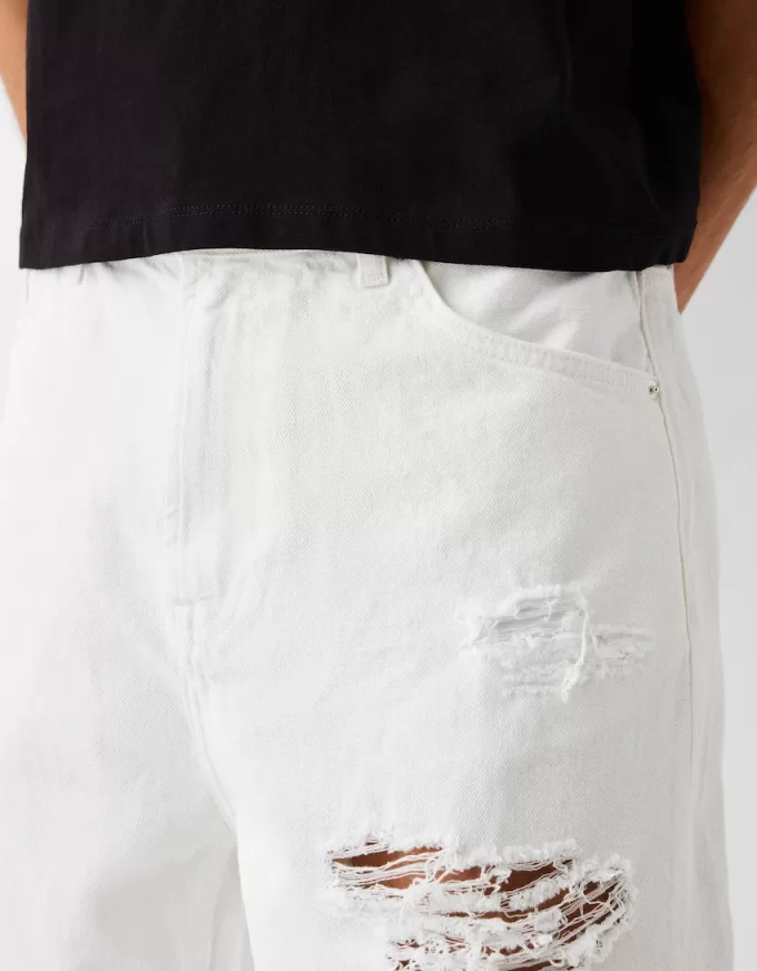 Bermuda in denim strappato