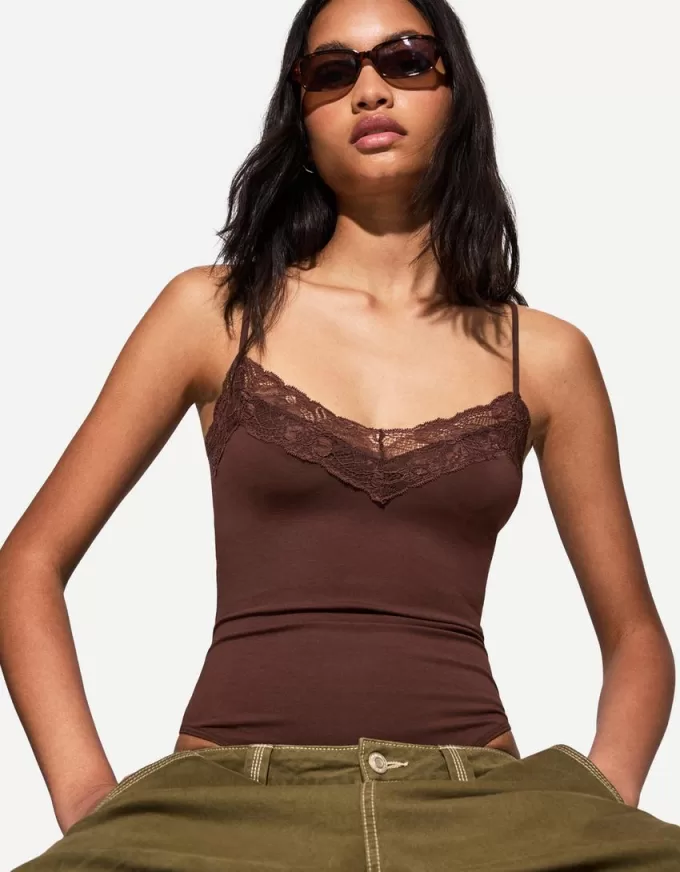 Body in pizzo biondo con spalline