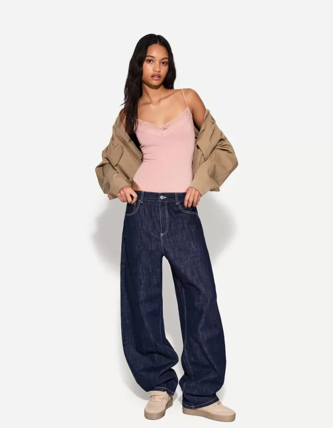 Body in pizzo biondo con spalline