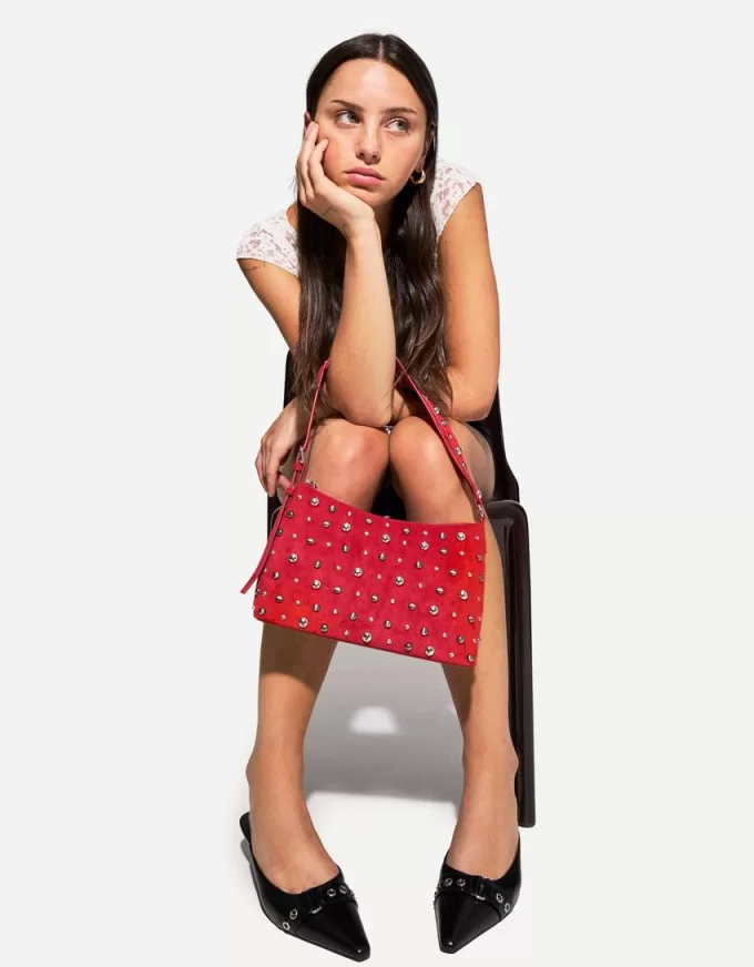 Borsa in finta pelle scamosciata borchiata