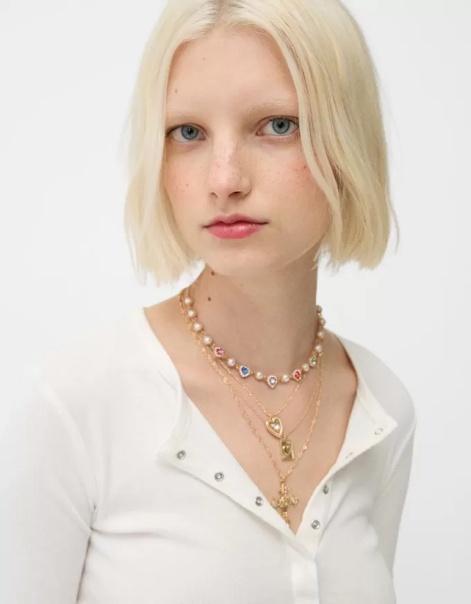 Confezione da 4 collane con croce di strass