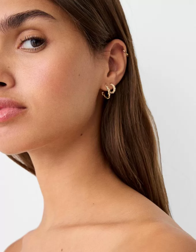 Confezione da 9 orecchini testurizzati