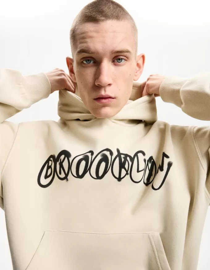 Felpa con cappuccio dalla vestibilità squadrata stampata