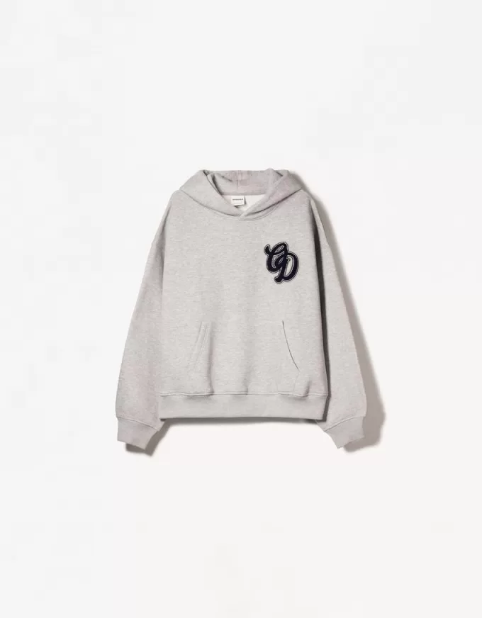 Felpa con cappuccio dalla vestibilità squadrata stampata