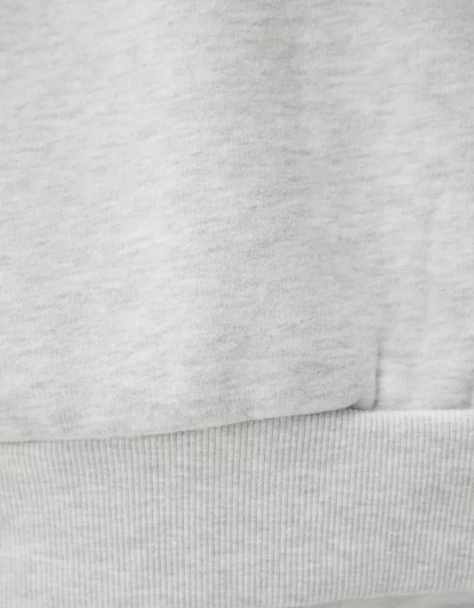 Felpa oversize con tasche laterali