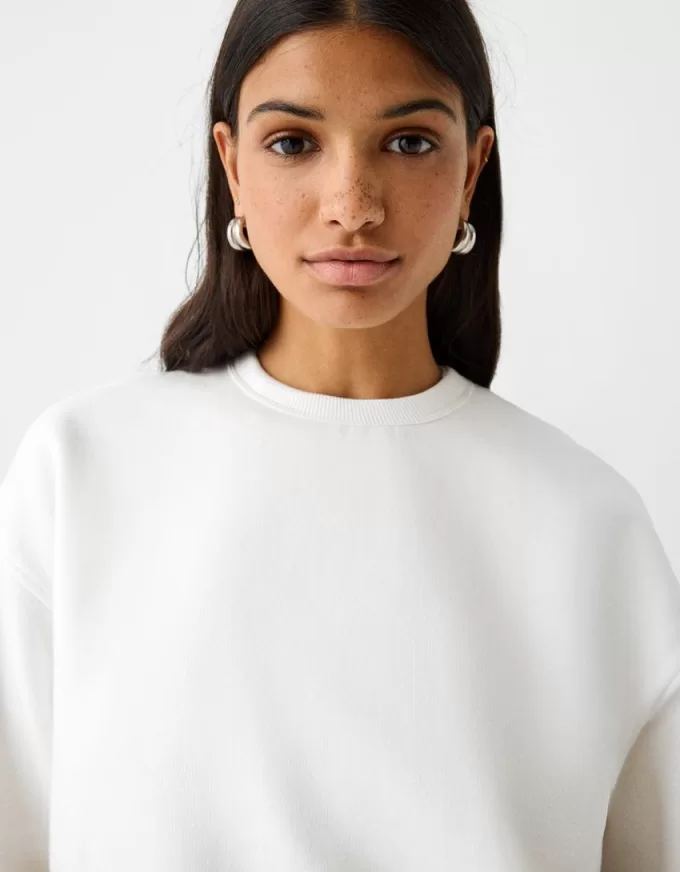 Felpa oversize con tasche laterali