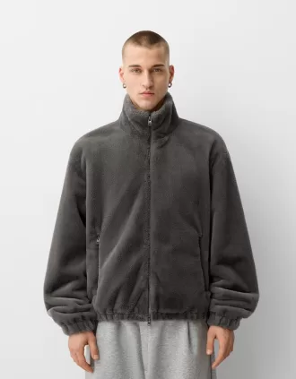 Giacca in pelliccia sintetica a collo alto con cerniera