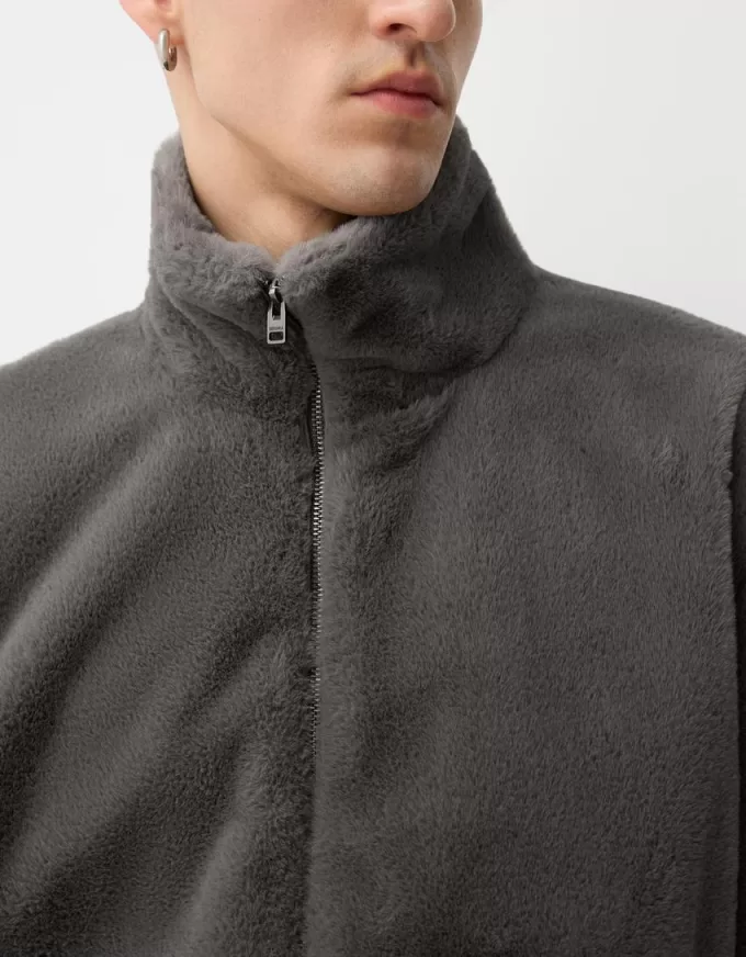 Giacca in pelliccia sintetica a collo alto con cerniera