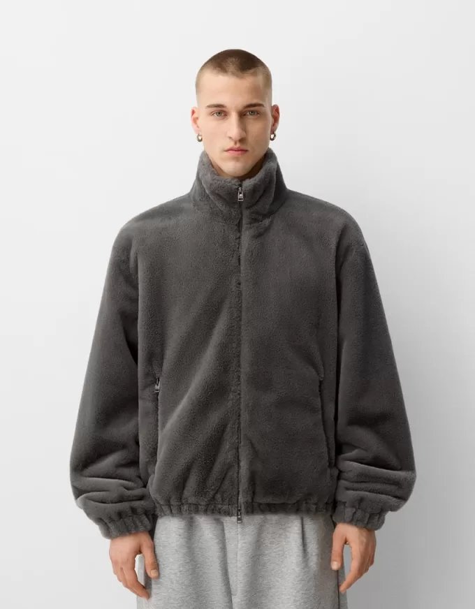 Giacca in pelliccia sintetica a collo alto con cerniera