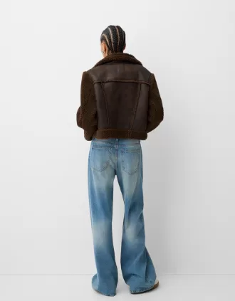 Giubbotto double face con maniche in finto montone