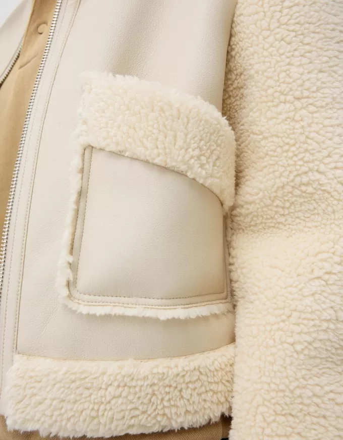 Giubbotto double face con maniche in finto montone