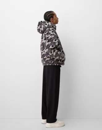 Giubbotto in finto montone con stampa