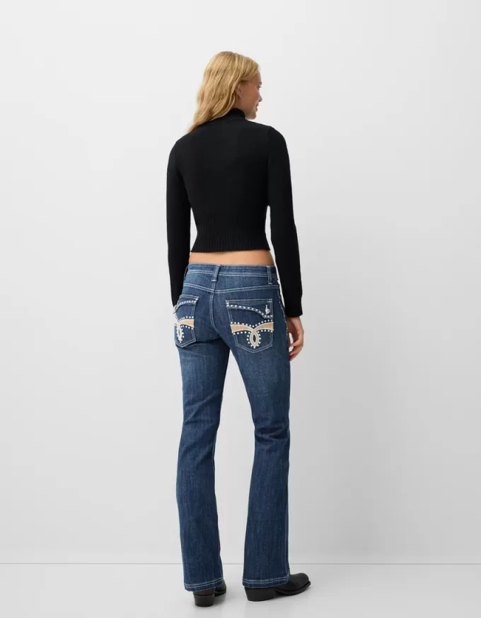 Jeans bootcut a vita bassa con ricami