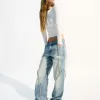 Jeans larghi con frange