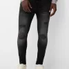 Jeans super skinny strappati