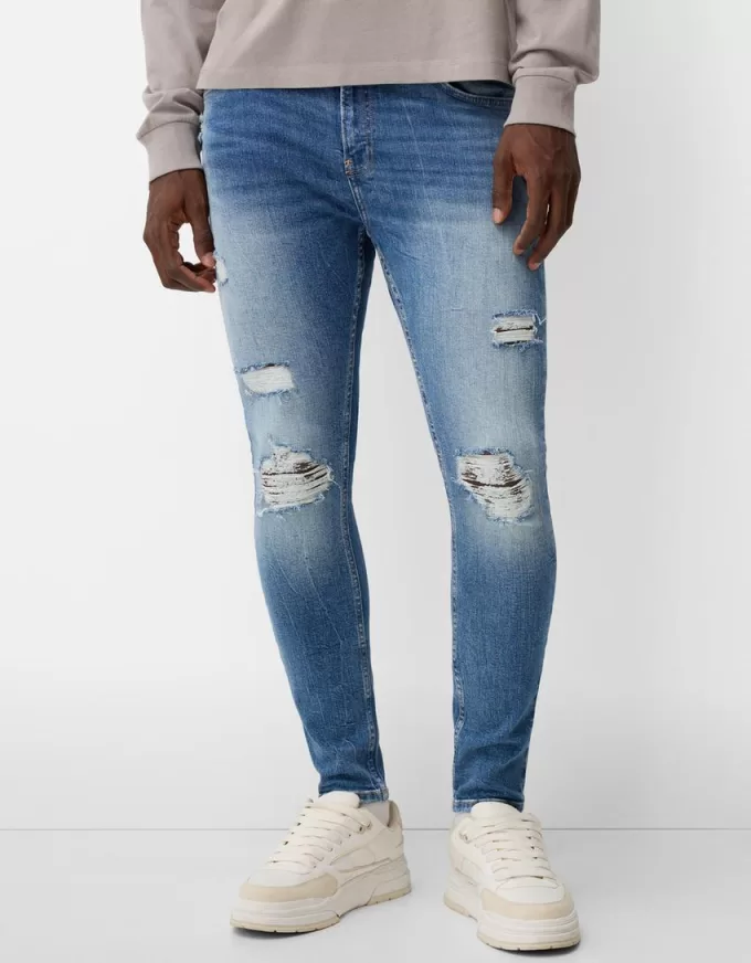 Jeans super skinny strappati