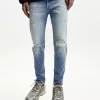 Jeans super skinny strappati