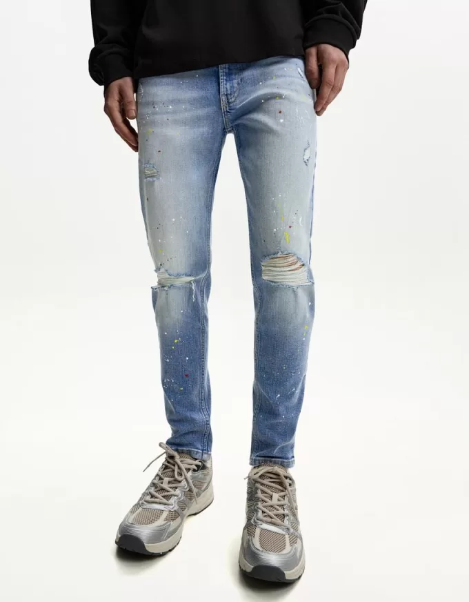 Jeans super skinny strappati