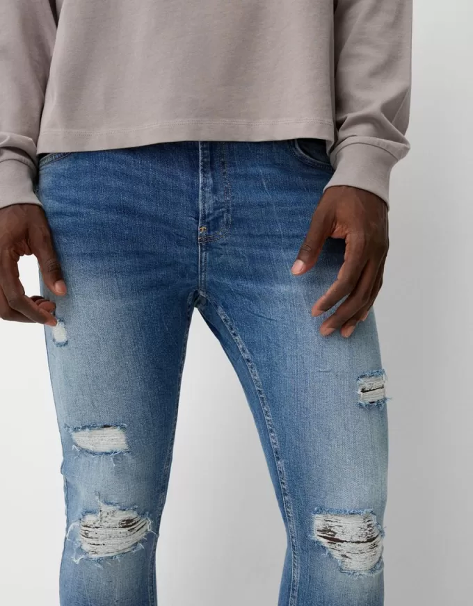 Jeans super skinny strappati
