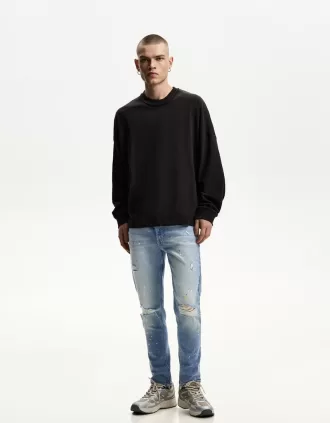 Jeans super skinny strappati