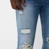 Jeans super skinny strappati