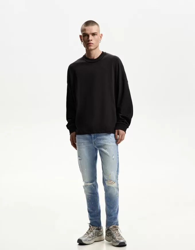 Jeans super skinny strappati