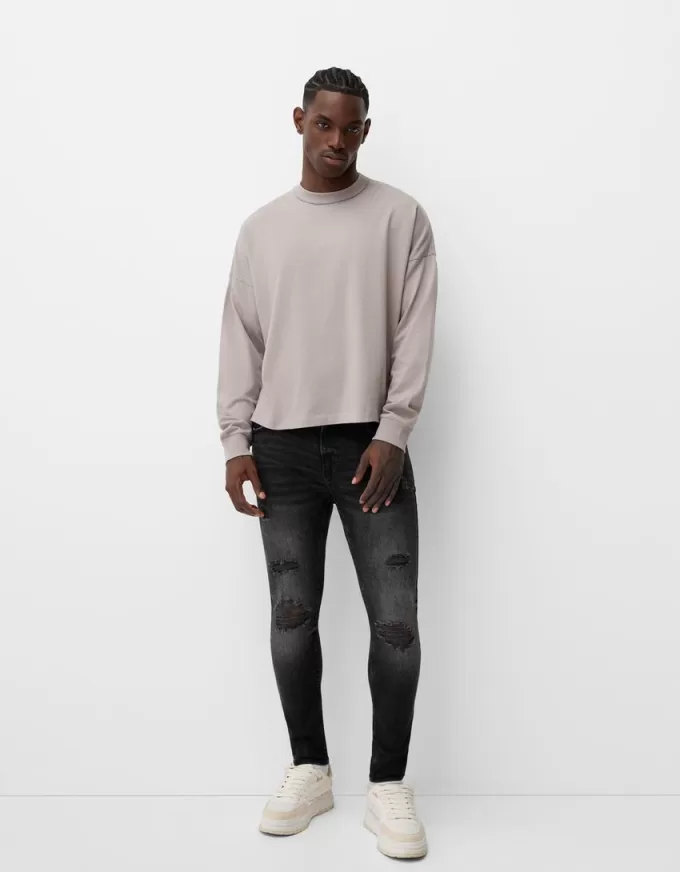 Jeans super skinny strappati