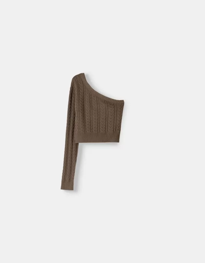 Maglione asimmetrico lavorato a trecce