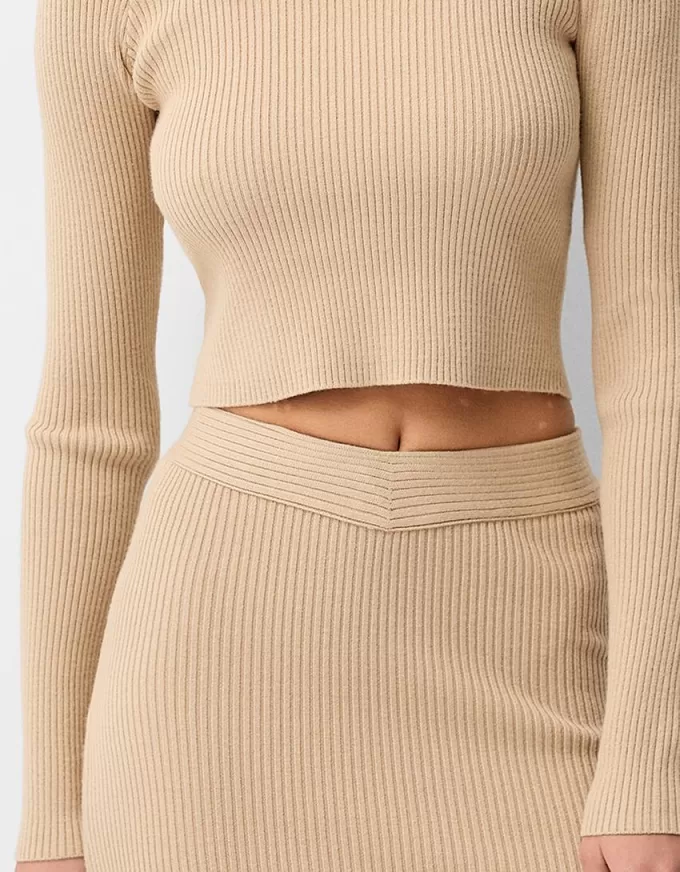 Maglione con scollo a V e spalle scoperte