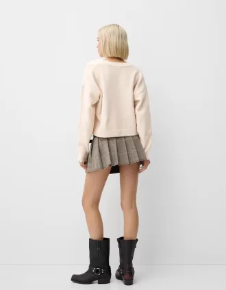 Maglione corto con scollo a V