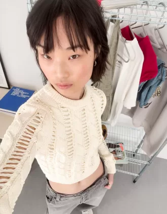 Maglione lavorato a trecce