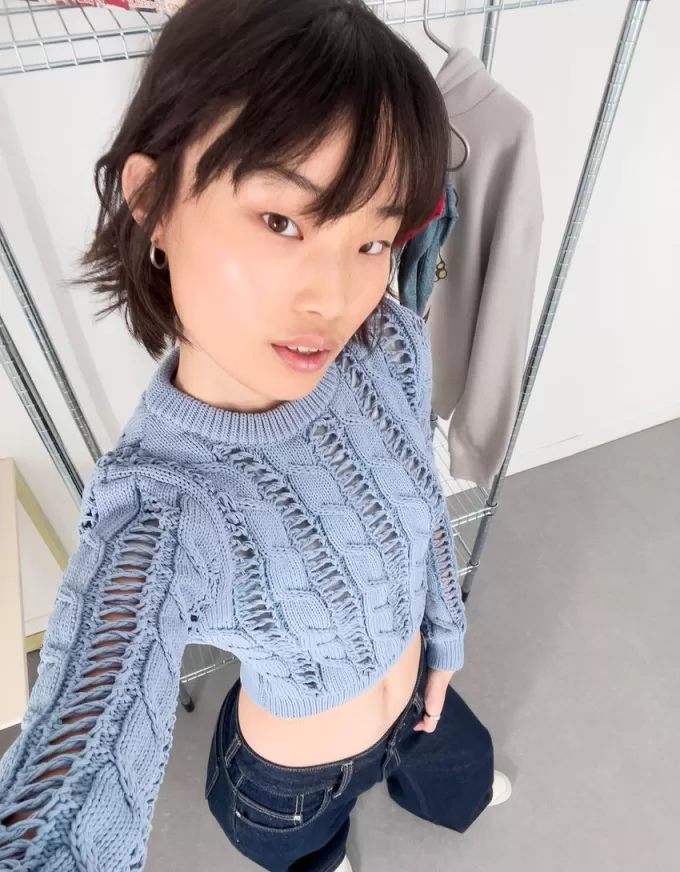 Maglione lavorato a trecce