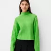 Maglione oversize cropped a costine a collo alto