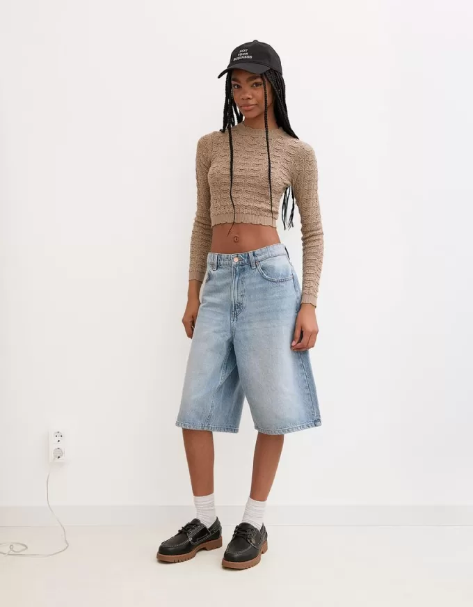 Maglione rustico a maglia aperta dal taglio corto