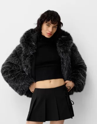 Minigonna a pieghe con dettaglio fiocco