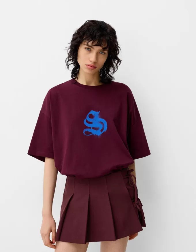 Minigonna a pieghe con dettaglio fiocco