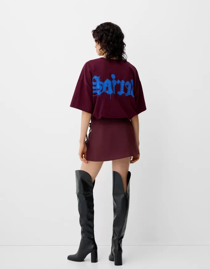 Minigonna a pieghe con dettaglio fiocco