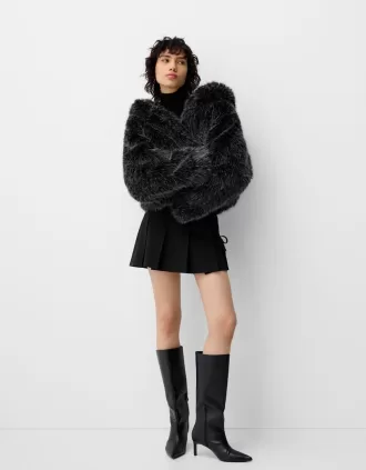 Minigonna a pieghe con dettaglio fiocco