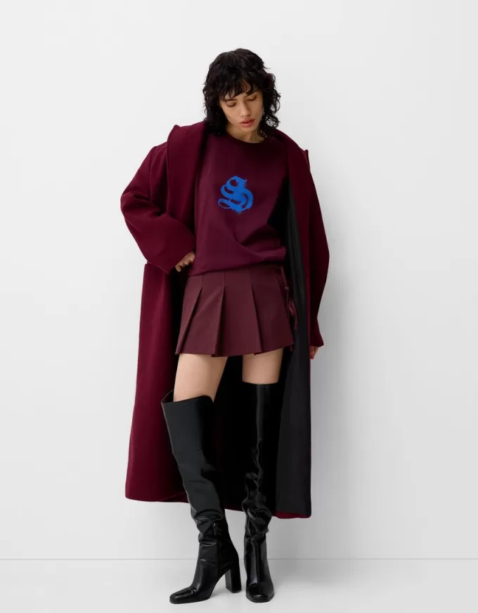 Minigonna a pieghe con dettaglio fiocco