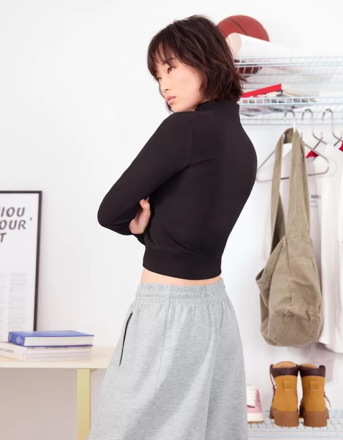 Pantaloni a botte in materiale felpato