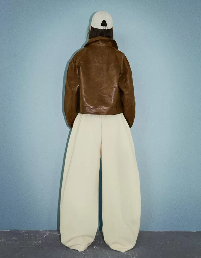 Pantaloni a botte in materiale felpato