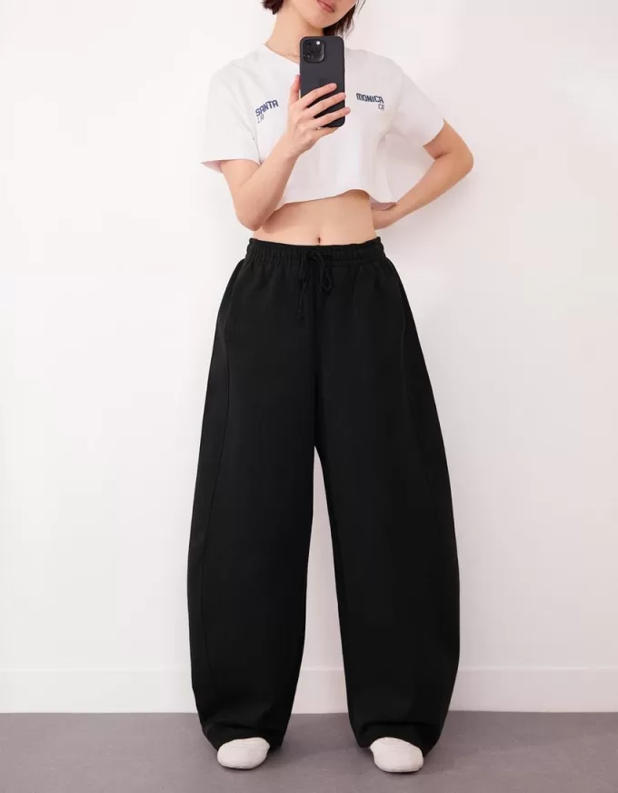 Pantaloni a botte in materiale felpato