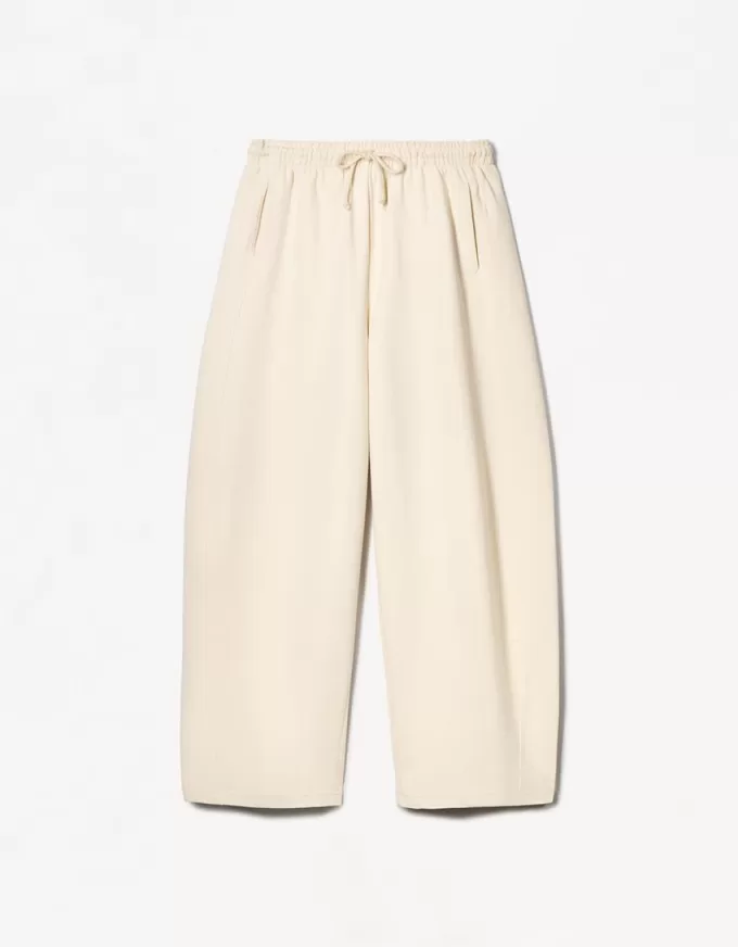 Pantaloni a botte in materiale felpato