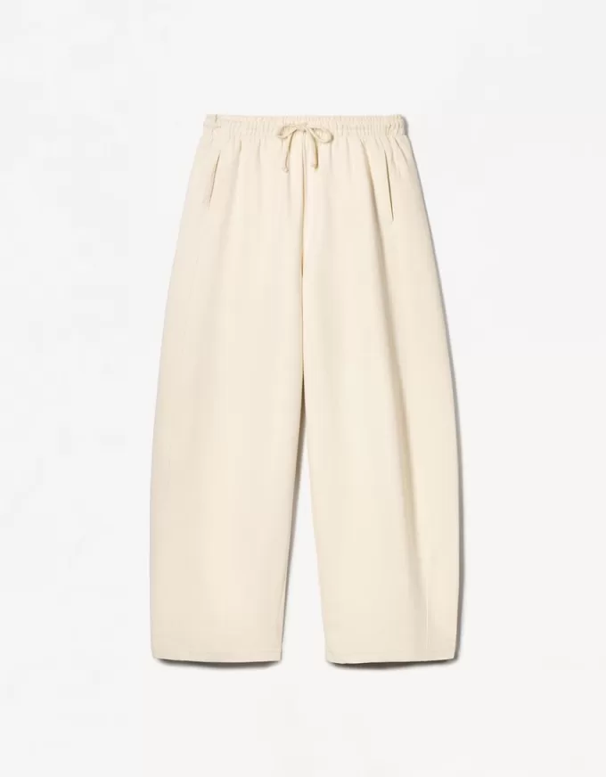 Pantaloni a botte in materiale felpato