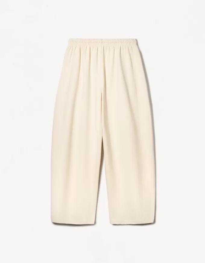 Pantaloni a botte in materiale felpato