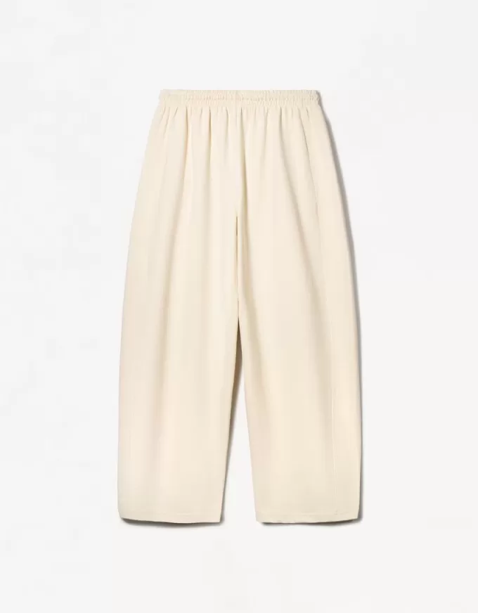 Pantaloni a botte in materiale felpato