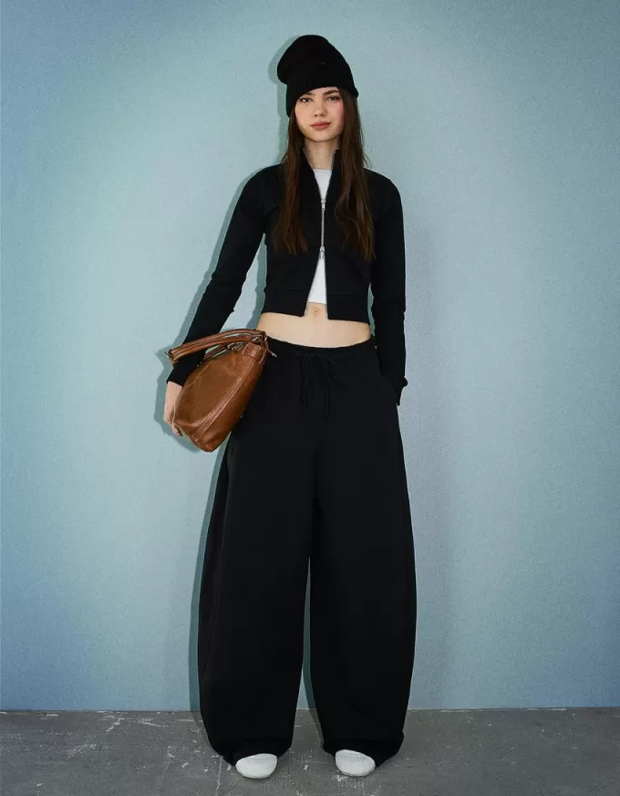 Pantaloni a botte in materiale felpato