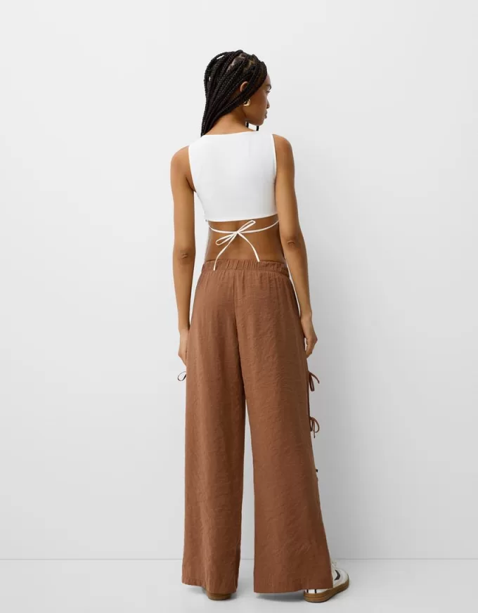 Pantaloni fluidi con lacci laterali