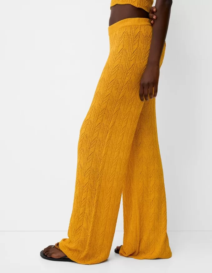 Pantaloni rustici svasati in maglia aperta